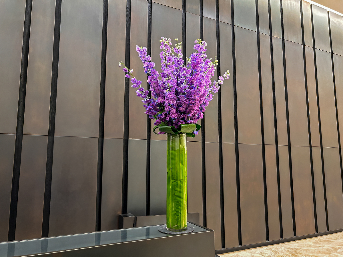 purple-floral-arrangement-at-lobby-desk