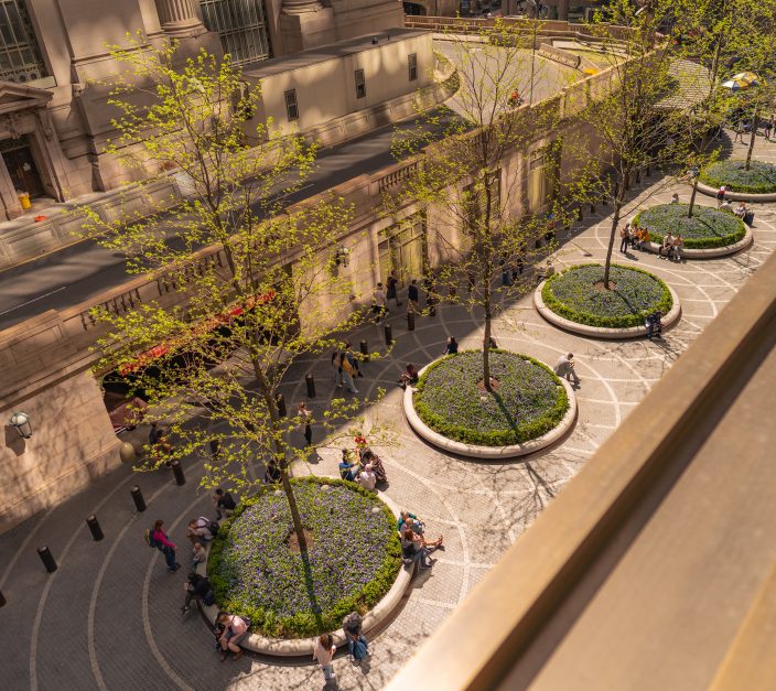 aerial view of commercial landscaping with circular planters and greenery in a Manhattan NYC plaza